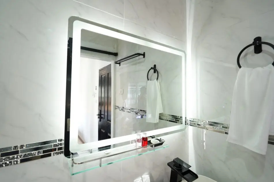 LED touchscreen bathroom mirror at Thonglor Suites Hotel