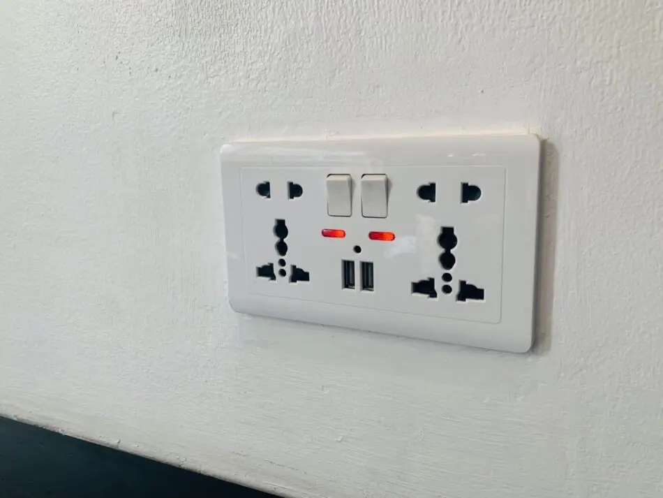 Universal power outlets and USB charging ports in a Thonglor Suites Hotel room
